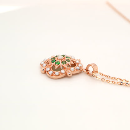 Pearl and tsavorite garnet pendant in 9k rose gold