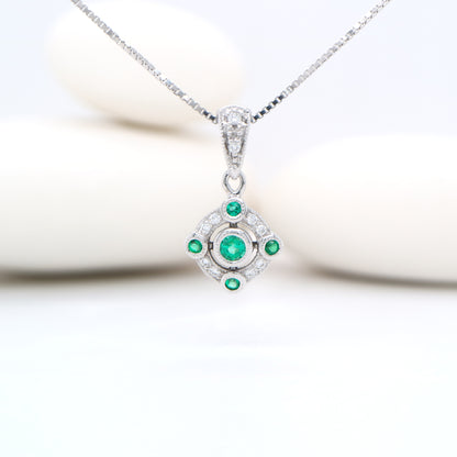 Emerald and diamond Circular pendant in 9k white gold
