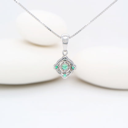 Emerald and diamond Circular pendant in 9k white gold