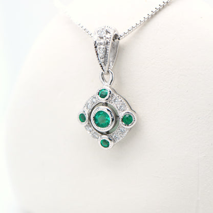 Emerald and diamond Circular pendant in 9k white gold