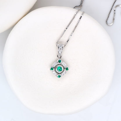 Emerald and diamond Circular pendant in 9k white gold