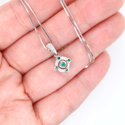 Emerald and diamond Circular pendant in 9k white gold