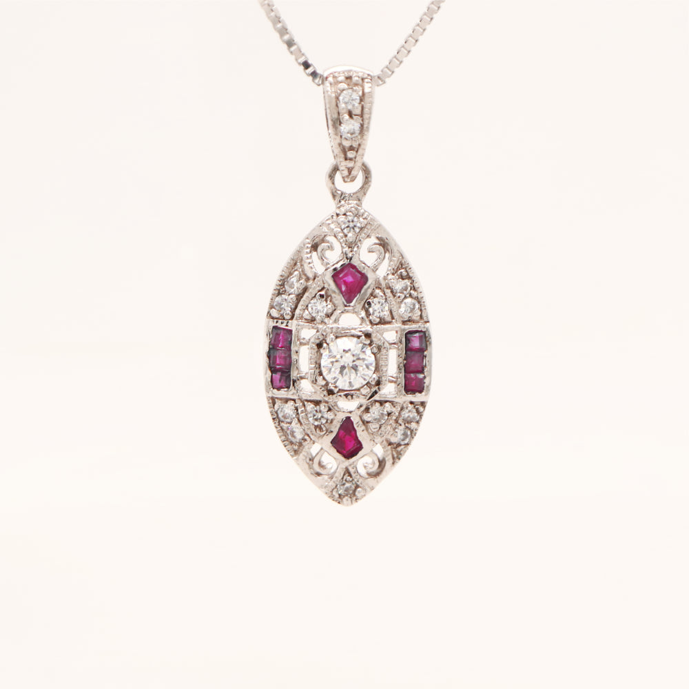 Vintage natural ruby and diamond shield pendant in 9k white gold