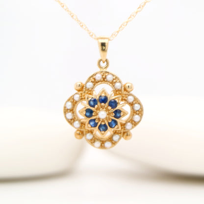 Pearl and natural sapphire pendant in 9k yellow gold