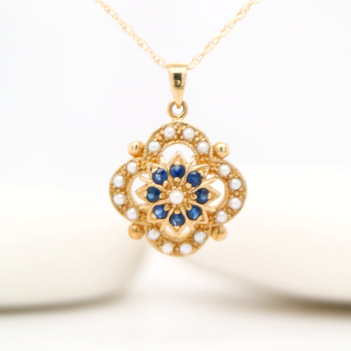 Pearl and natural sapphire pendant in 9k yellow gold
