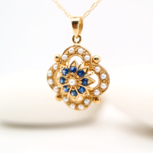 Pearl and natural sapphire pendant in 9k yellow gold