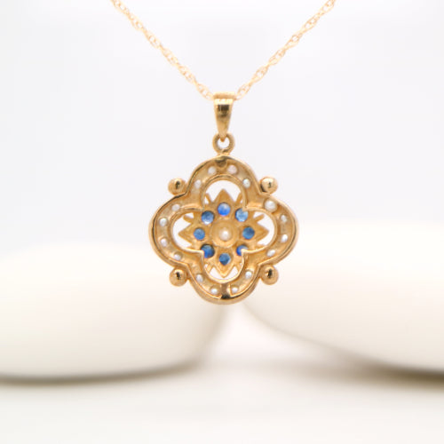 Pearl and natural sapphire pendant in 9k yellow gold