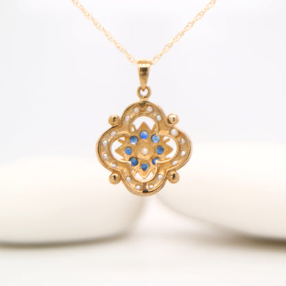 Pearl and natural sapphire pendant in 9k yellow gold