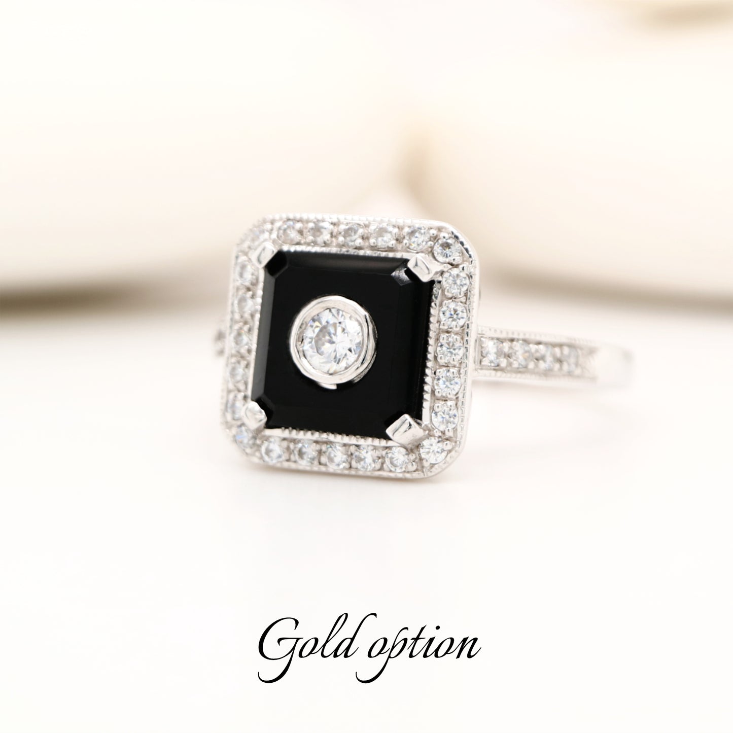 Square art deco style diamond and black onyx ring in white gold