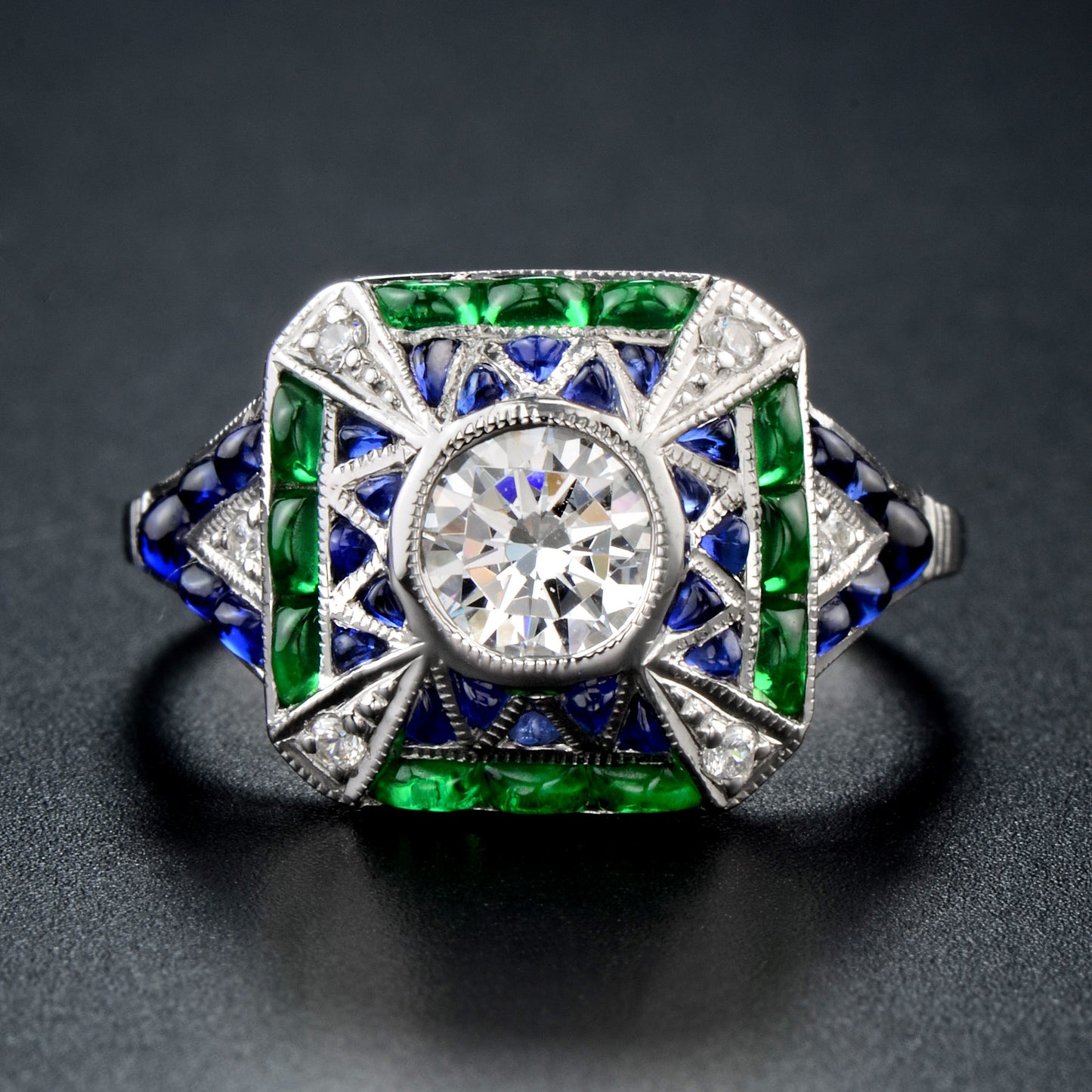 Cabochon set emerald sapphire diamond ring in white gold