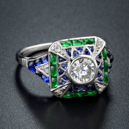 Cabochon set emerald sapphire diamond ring in white gold