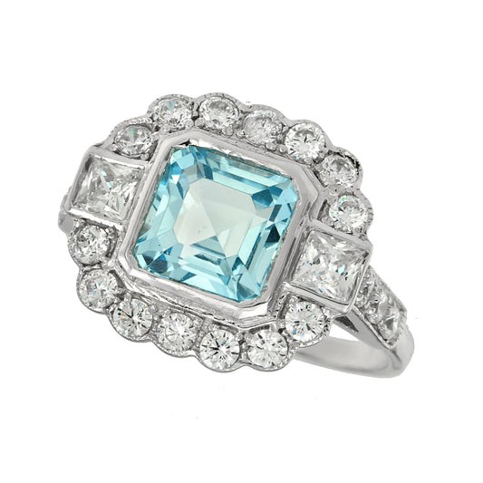 Art deco blue topaz rign with cz halo and shoulders in sterling silver
