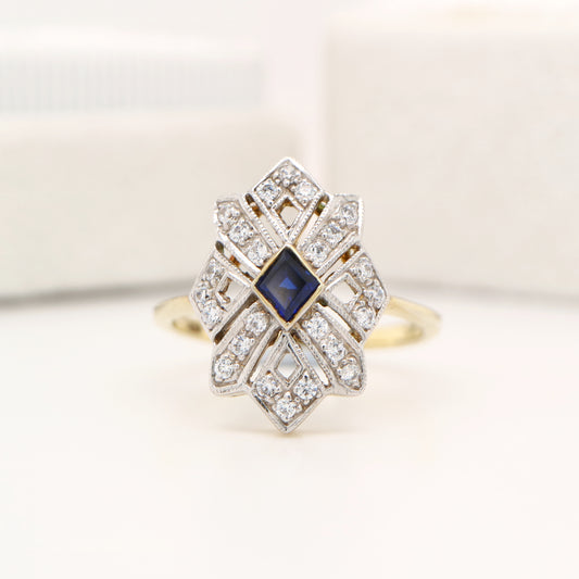 Starburst shield ring with natural sapphire and diamond in twin gold
