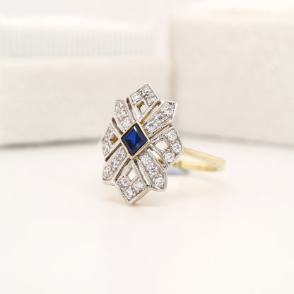 Starburst shield ring with natural sapphire and diamond in twin gold