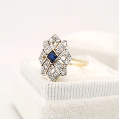 Starburst shield ring with natural sapphire and diamond in twin gold