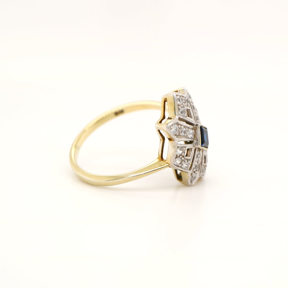 Starburst shield ring with natural sapphire and diamond in twin gold
