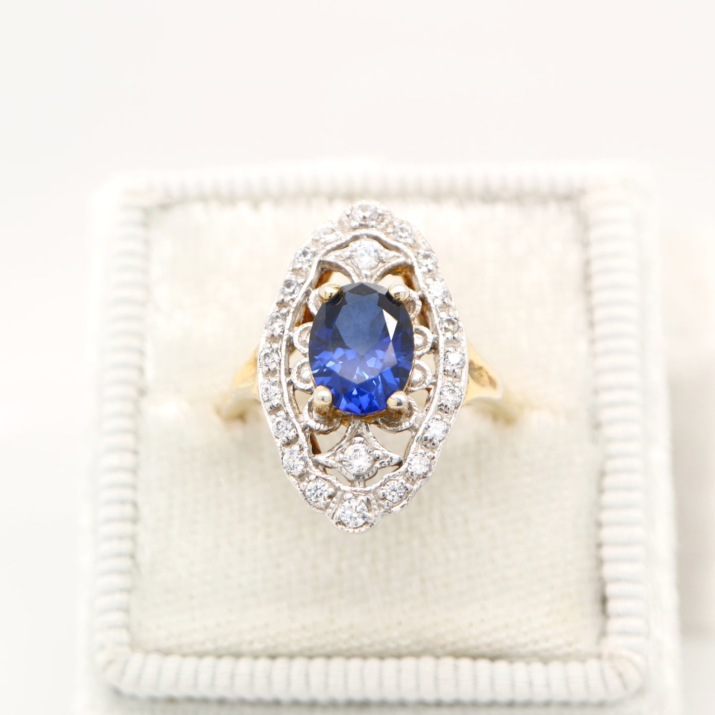 Blue sapphire and diamond cocktail shield ring in twin gold