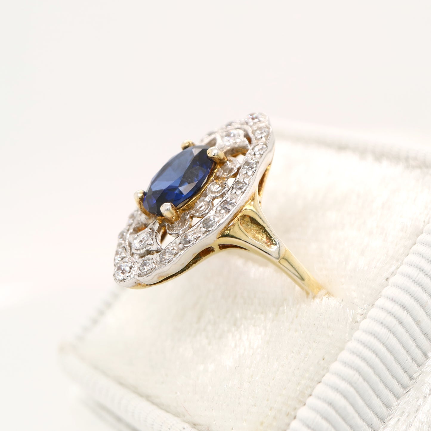 Blue sapphire and diamond cocktail shield ring in twin gold