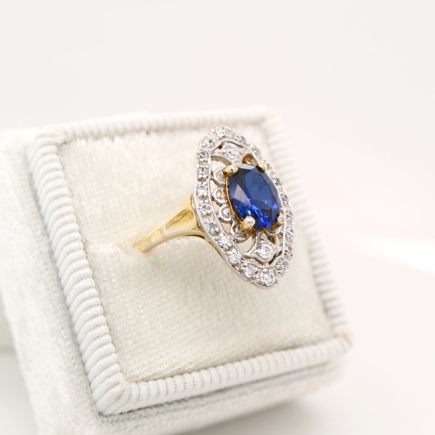 Blue sapphire and diamond cocktail shield ring in twin gold