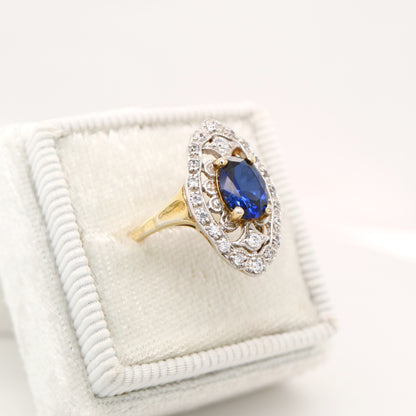 Blue sapphire and diamond cocktail shield ring in twin gold