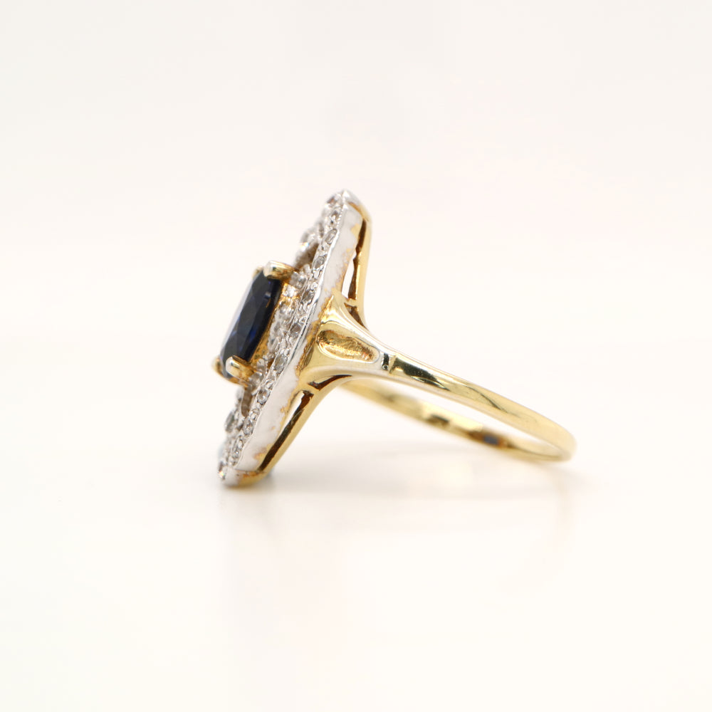 Blue sapphire and diamond cocktail shield ring in twin gold