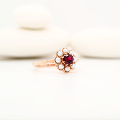 Garnet with pearl halo ring in 9k rose gold