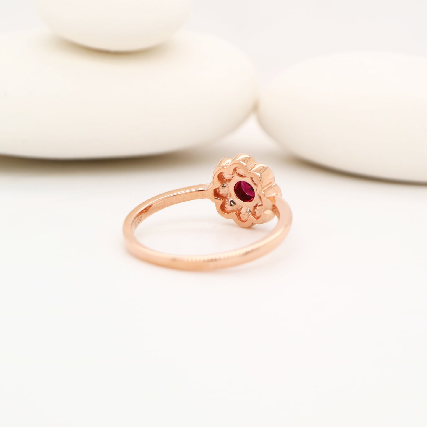 Garnet with pearl halo ring in 9k rose gold