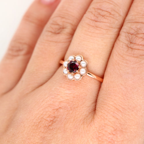Garnet with pearl halo ring in 9k rose gold