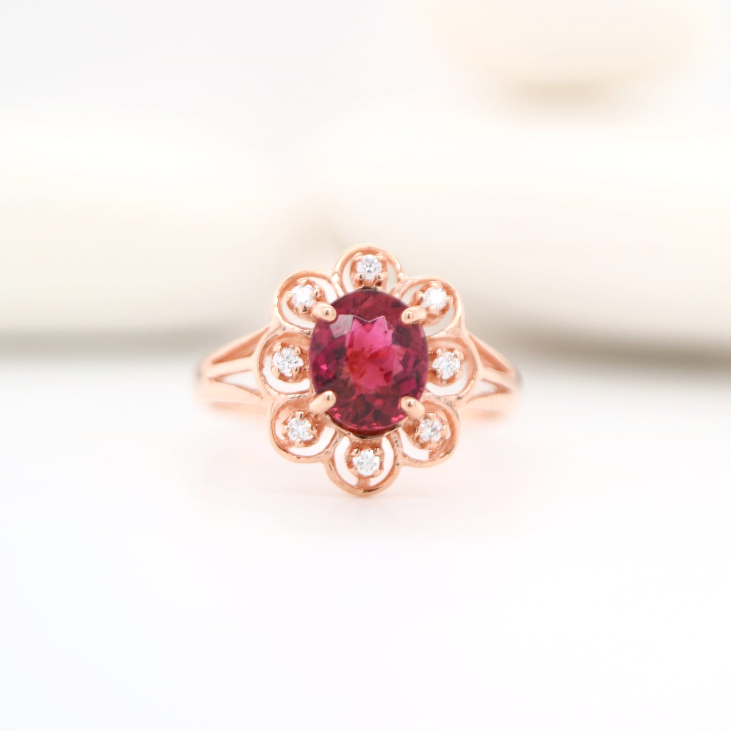 Floral diamond ring with tourmaline center in rose gold, Size P
