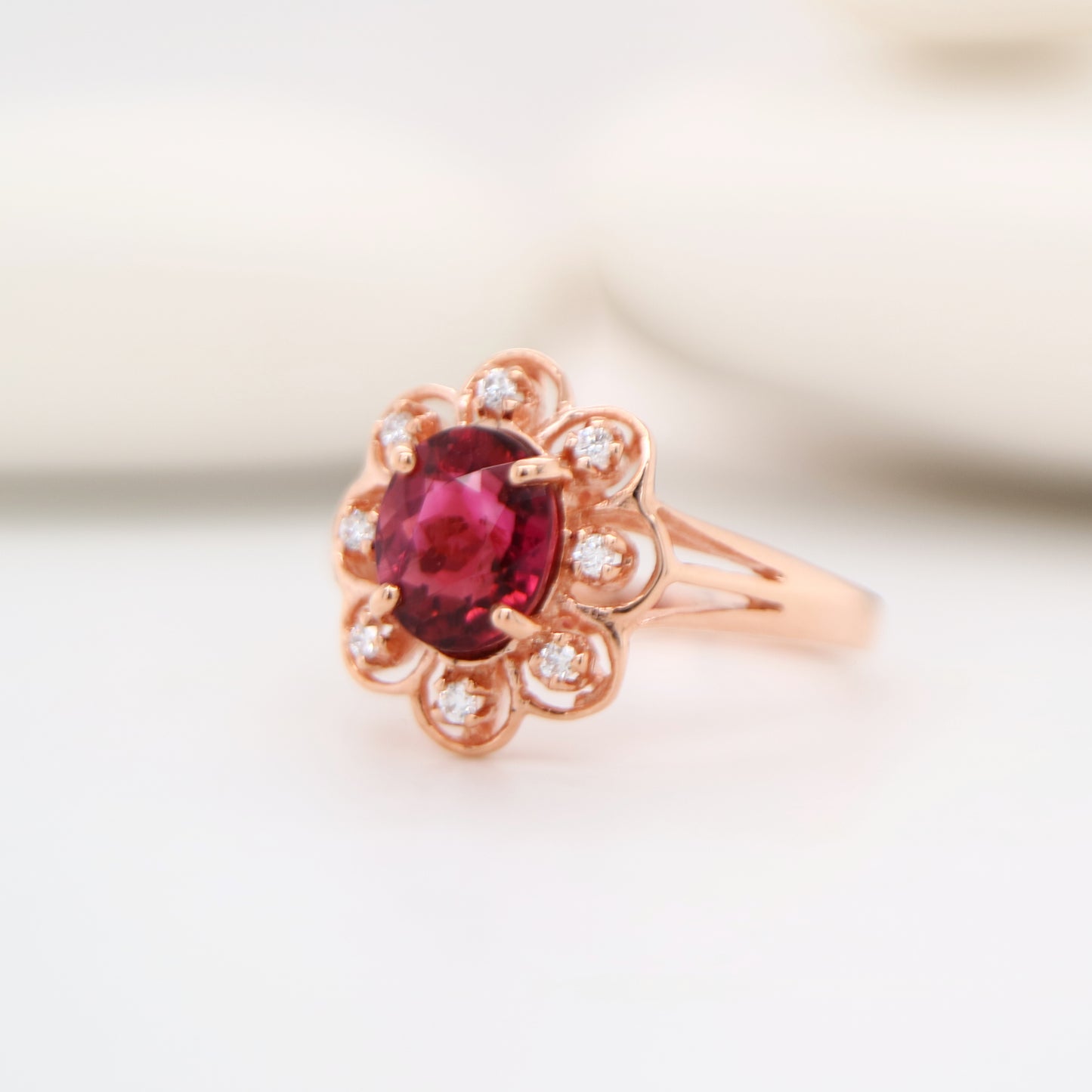 Floral diamond ring with tourmaline center in rose gold, Size P