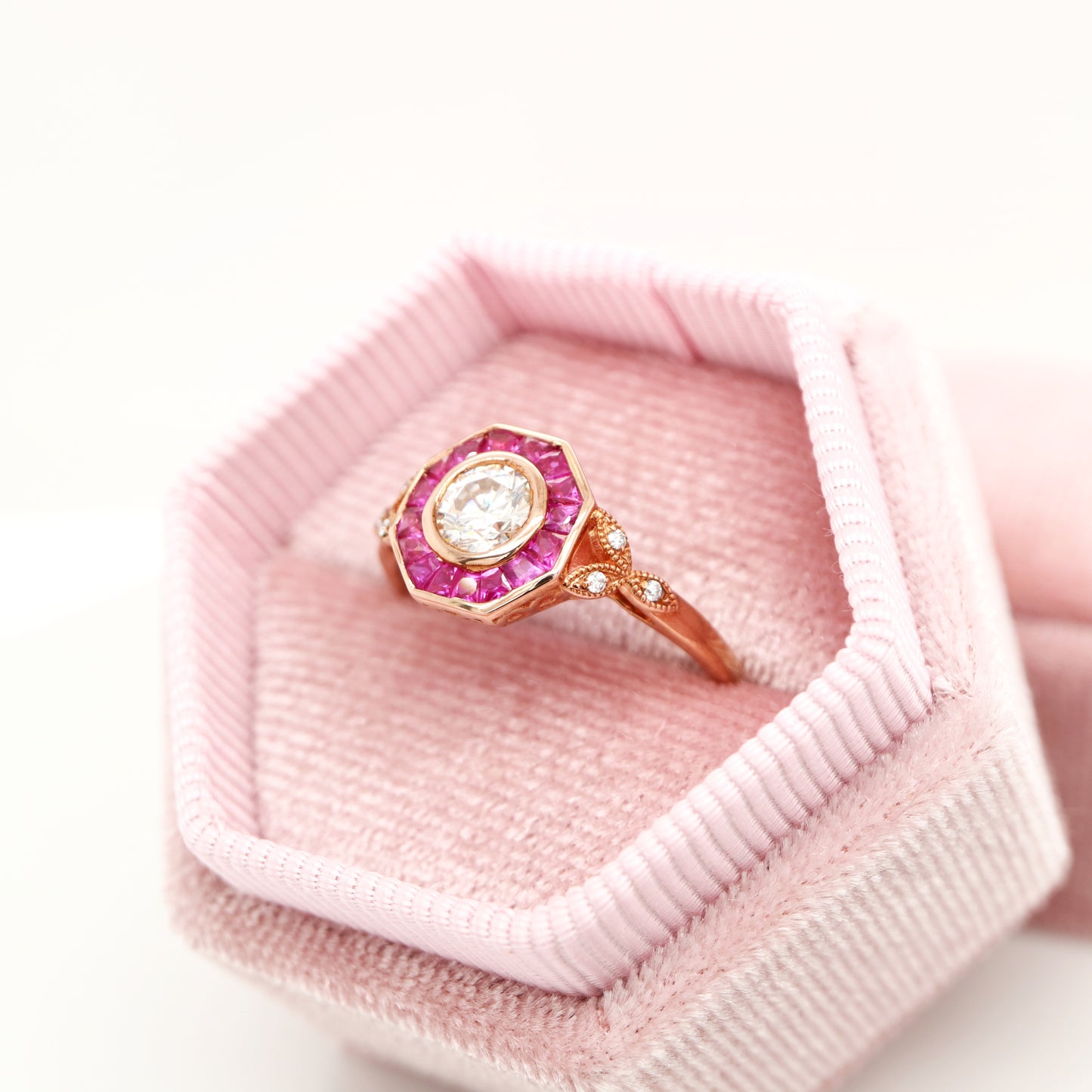 Target ring with moissanite and channel set natural ruby in rose gold