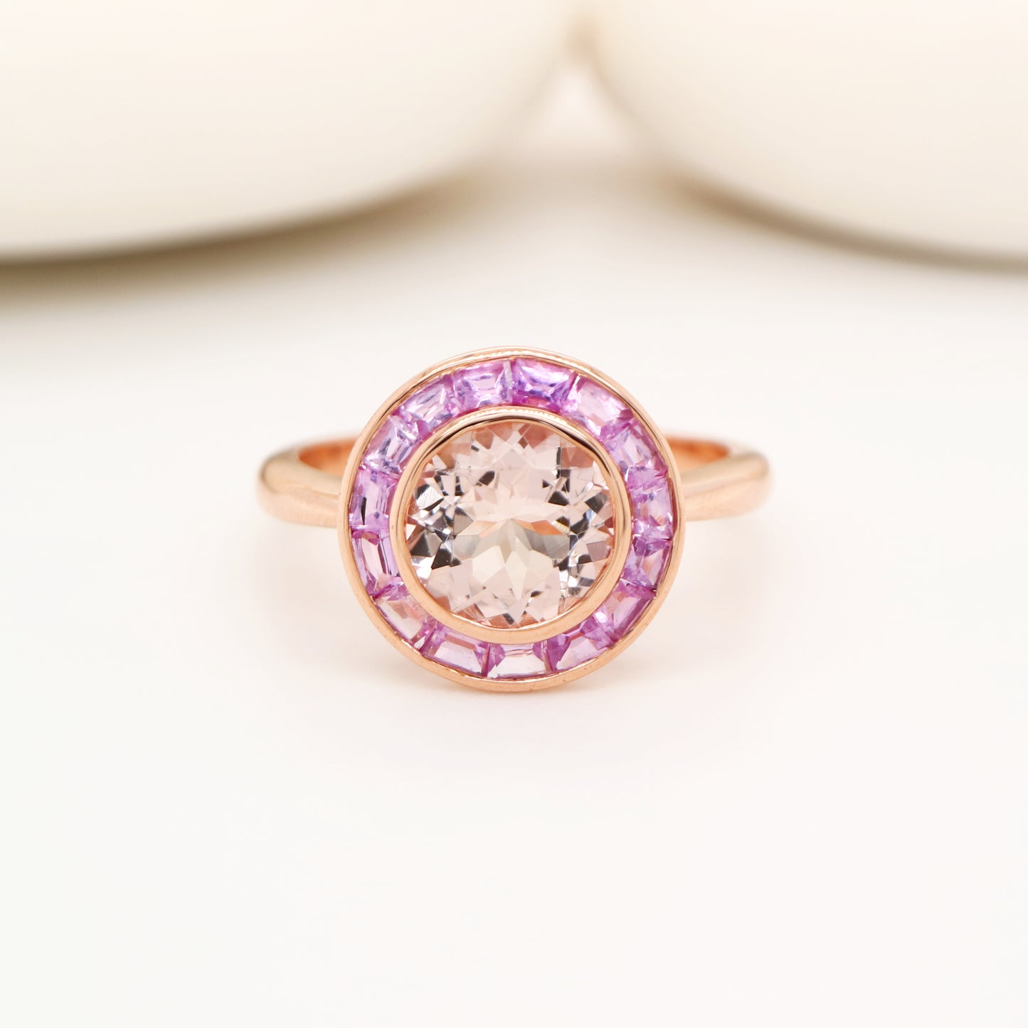 Morganite with pink sapphire halo ring in rose gold