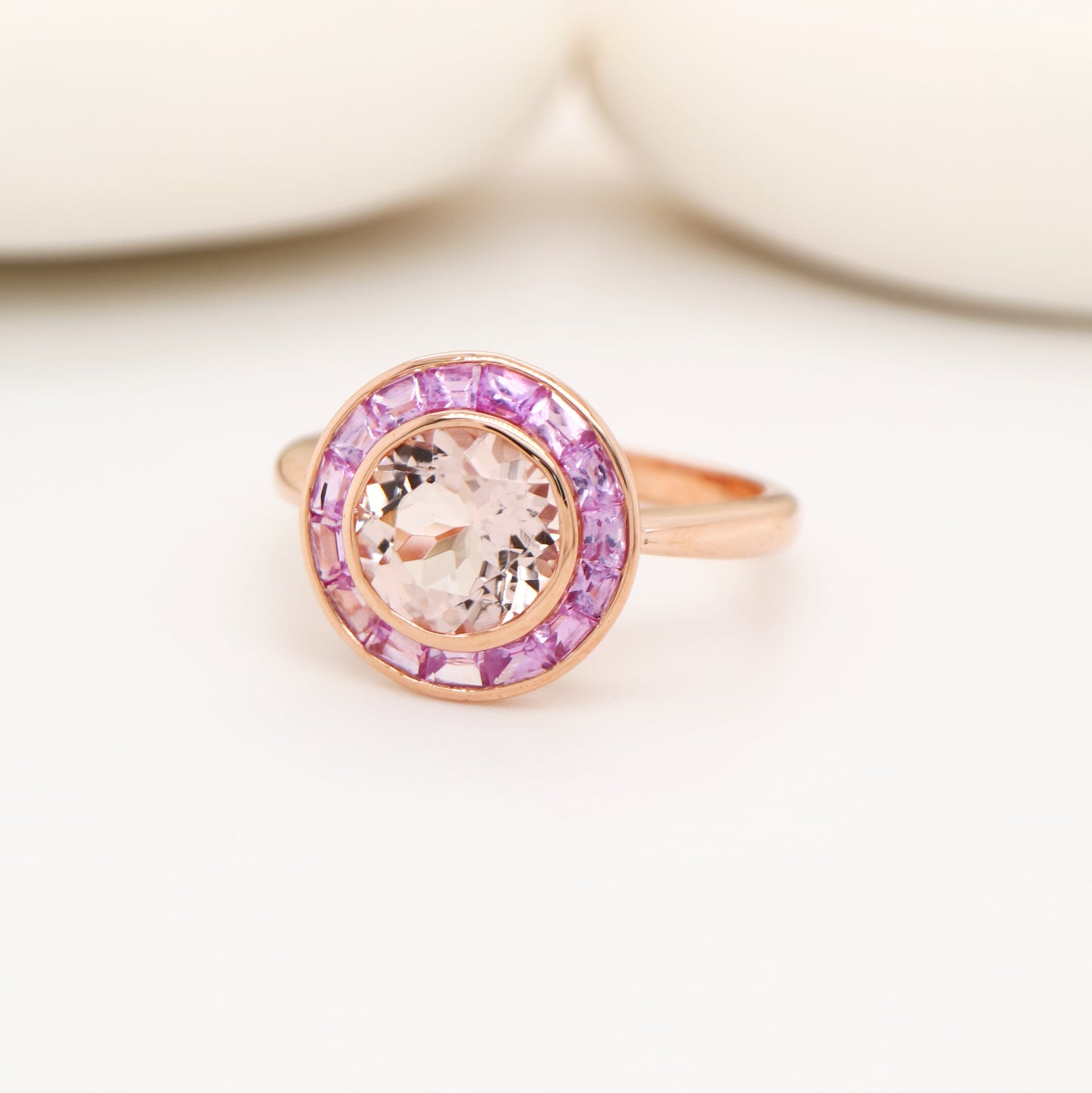 Morganite with pink sapphire halo ring in rose gold