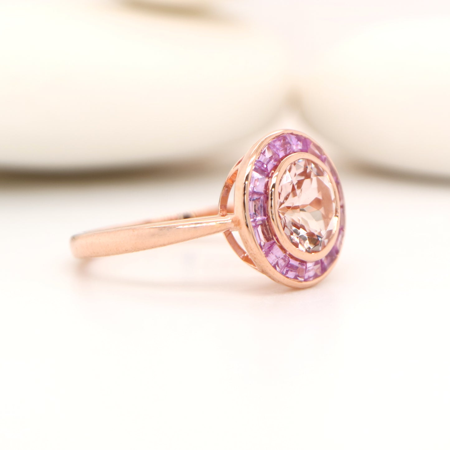 Morganite with pink sapphire halo ring in rose gold