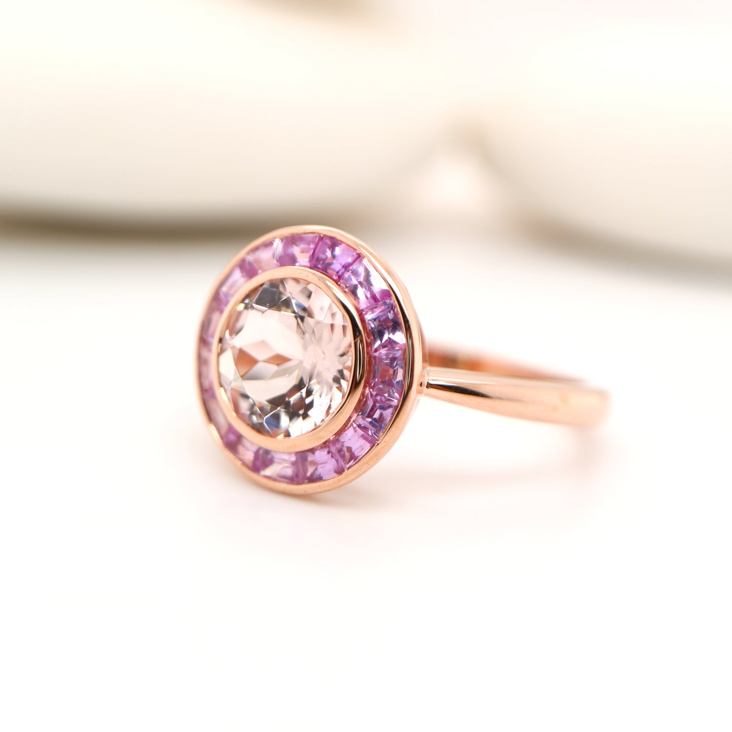 Morganite with pink sapphire halo ring in rose gold