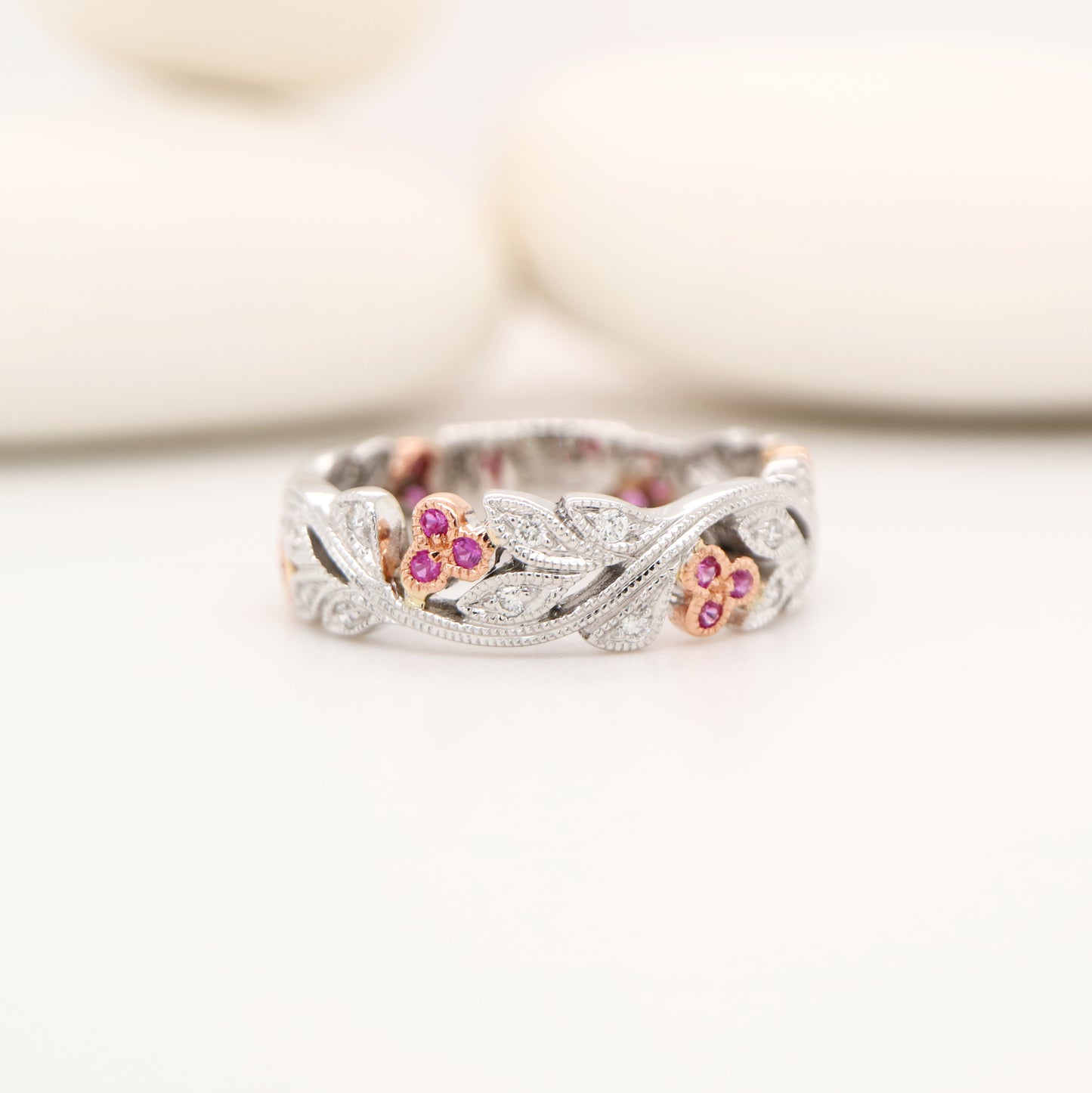 White gold vine and rose gold berries with pink sapphire and diamond