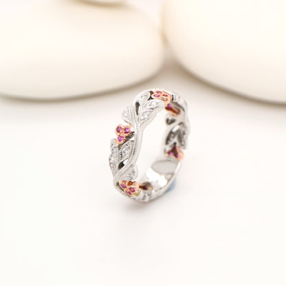 White gold vine and rose gold berries with pink sapphire and diamond