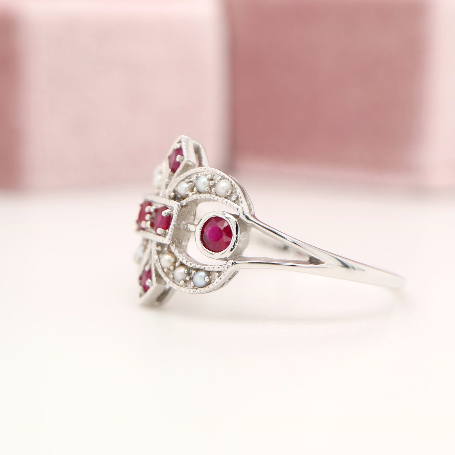 White gold fleur-de-lis ring with ruby and seed pearl