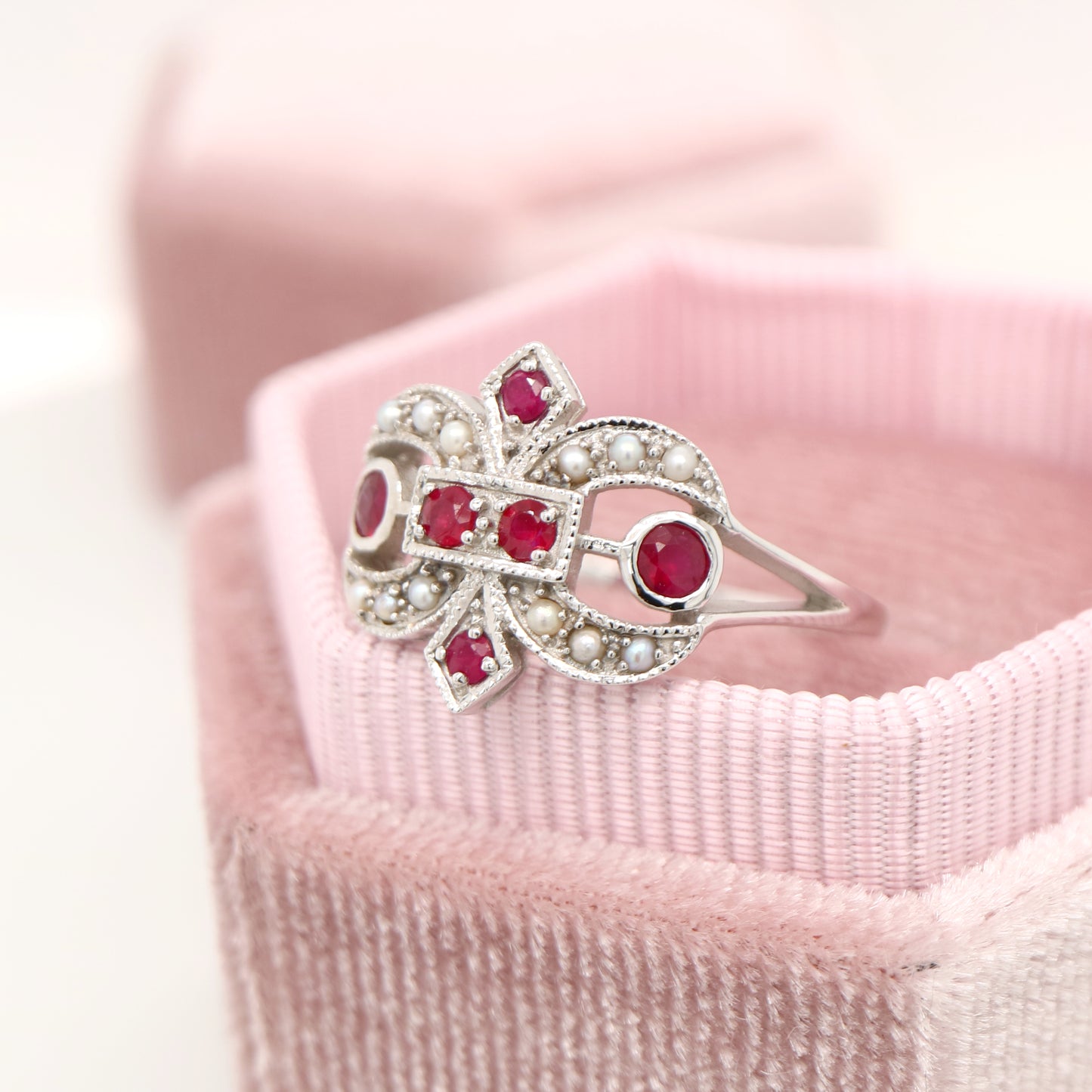 White gold fleur-de-lis ring with ruby and seed pearl