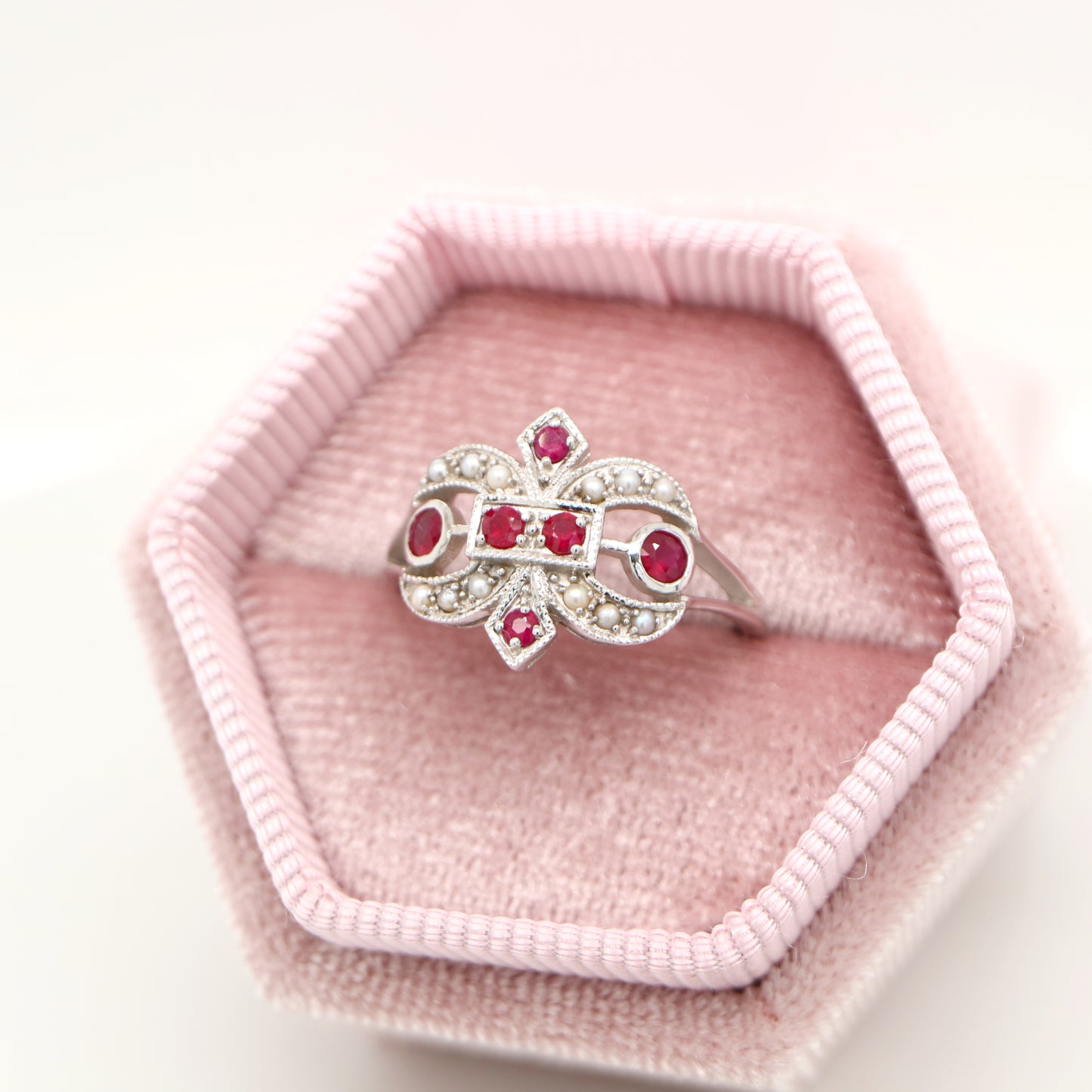 White gold fleur-de-lis ring with ruby and seed pearl