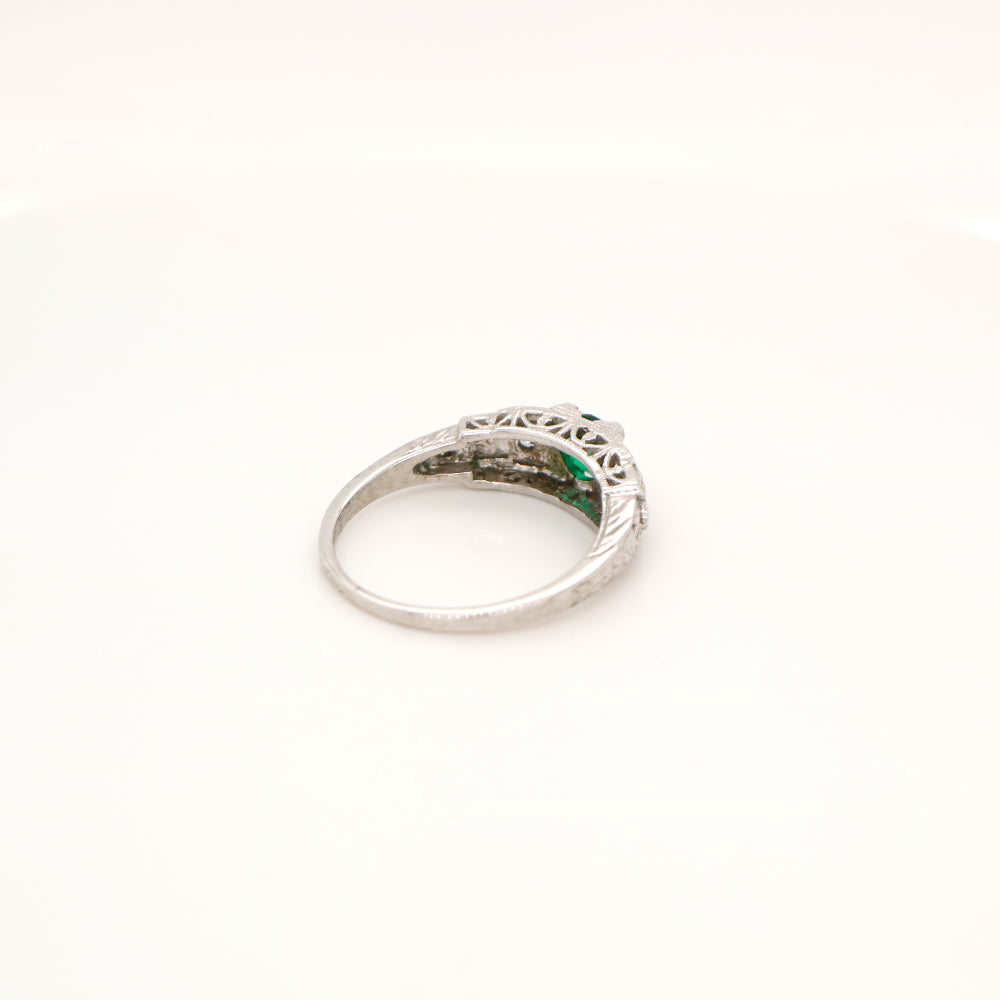 Art deco white gold ring with center emerald and shoulder diamond