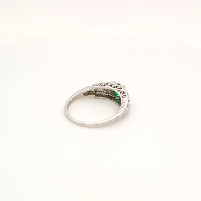 Art deco white gold ring with center emerald and shoulder diamond