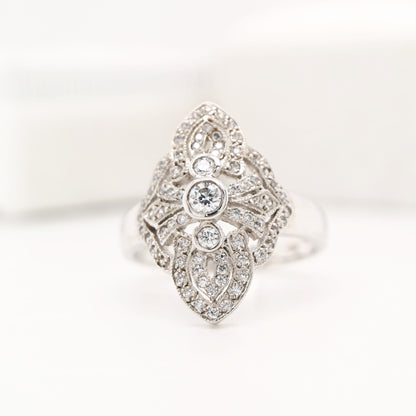 Vintage filigree shield ring in white gold with natural diamonds