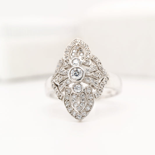 Vintage filigree shield ring in white gold with natural diamonds