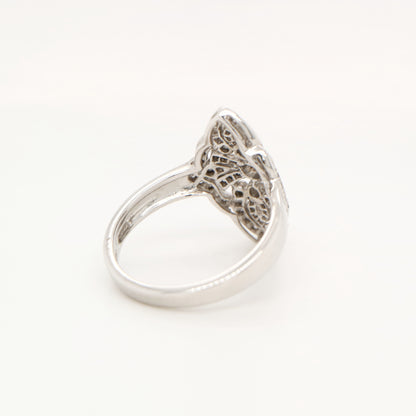 Vintage filigree shield ring in white gold with natural diamonds