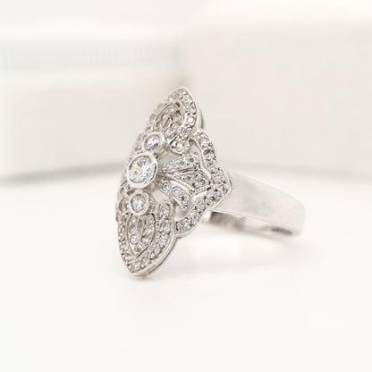 Vintage filigree shield ring in white gold with natural diamonds