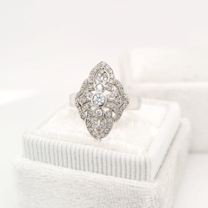 Vintage filigree shield ring in white gold with natural diamonds