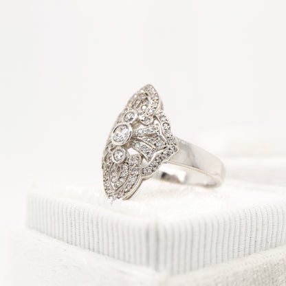 Vintage filigree shield ring in white gold with natural diamonds