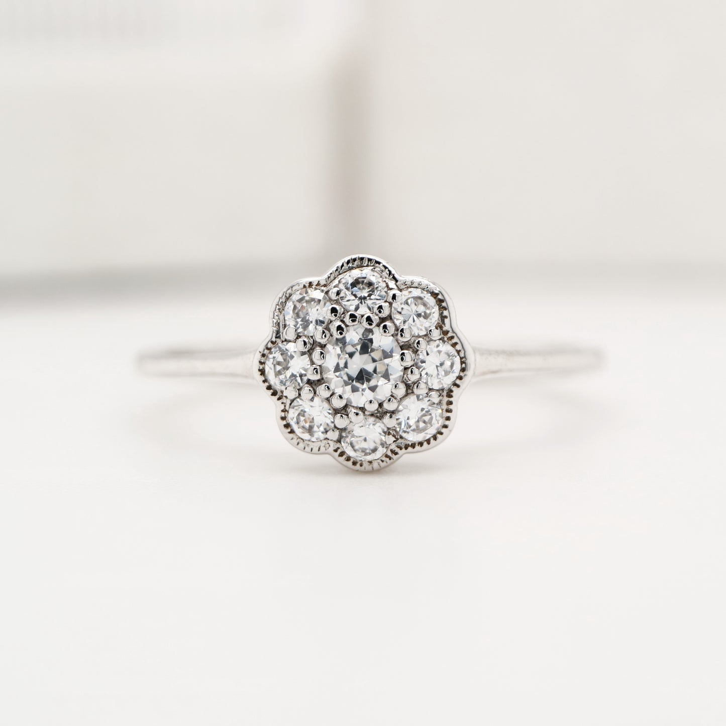 Dainty daisy diamond ring in white gold