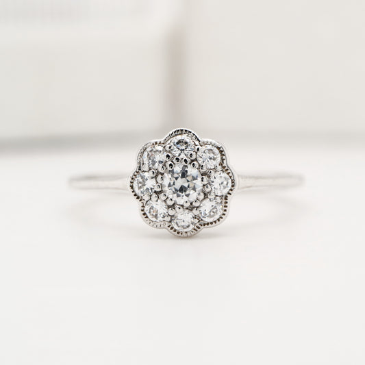 Dainty daisy diamond ring in white gold